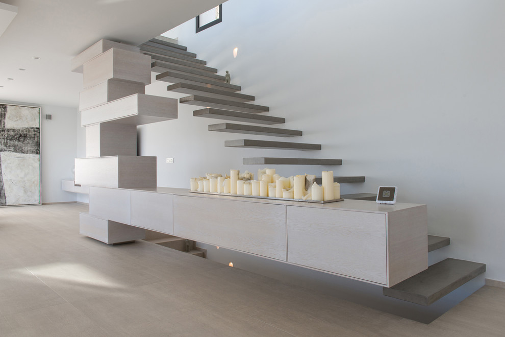 This is an example of a contemporary painted wood floating staircase in Alicante-Costa Blanca with open risers.
