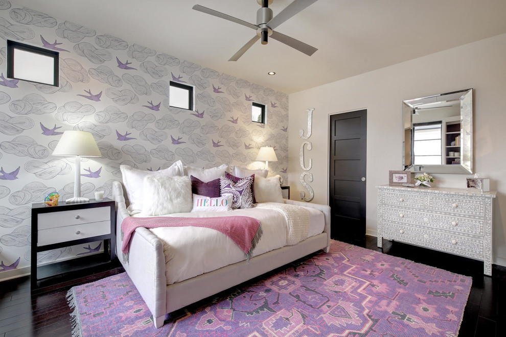 This is an example of a contemporary kids' bedroom for girls in Austin with grey walls, dark hardwood floors and brown floor.