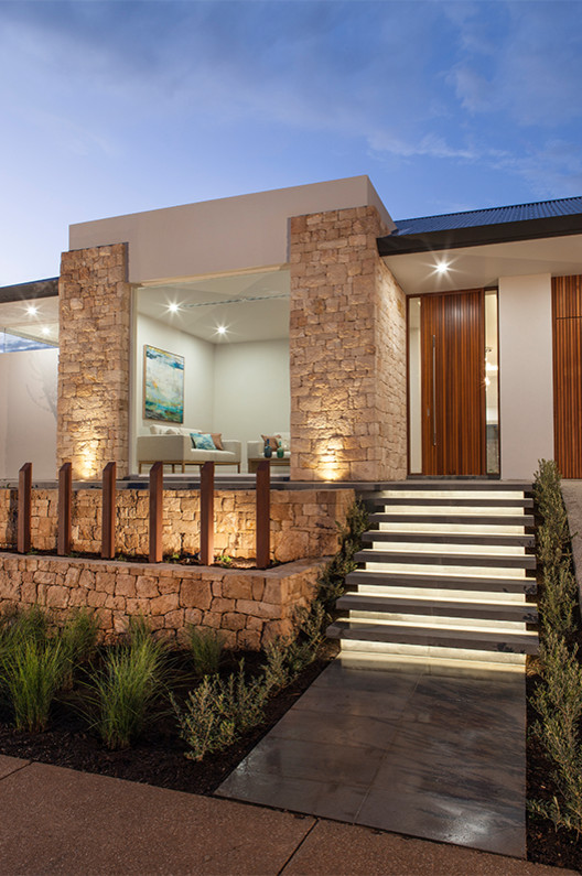 Design ideas for a contemporary one-storey exterior in Adelaide with stone veneer and a hip roof.