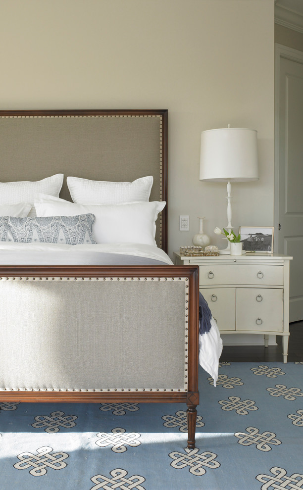 Inspiration for a large transitional guest bedroom in New York with beige walls and carpet.