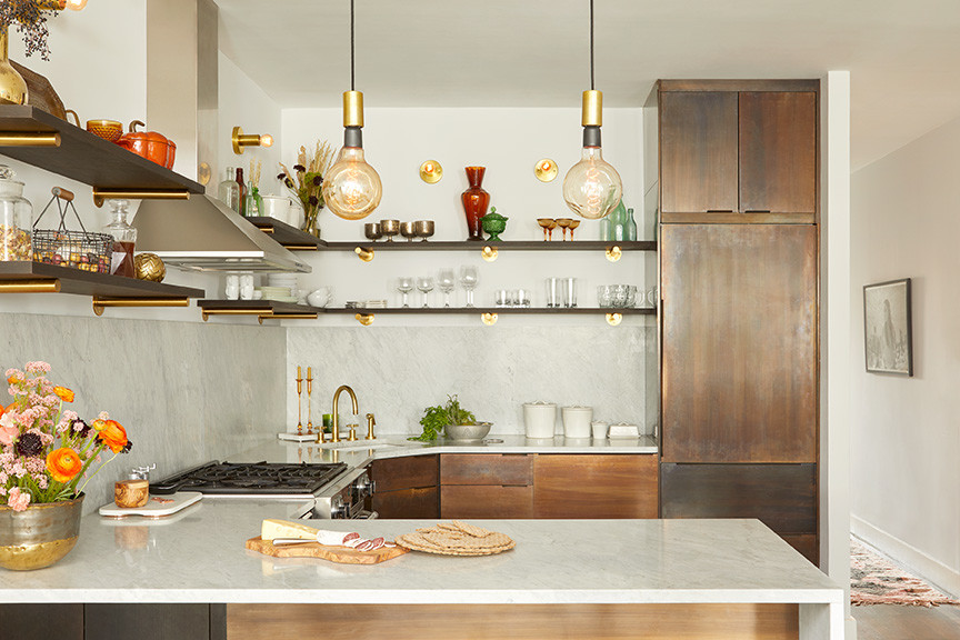 Photo of a small scandinavian u-shaped eat-in kitchen in New York with an undermount sink, flat-panel cabinets, marble benchtops, white splashback, marble splashback, coloured appliances, no island, medium wood cabinets, dark hardwood floors and brown floor.