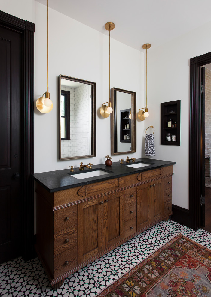 Photo of an eclectic master bathroom in Austin with dark wood cabinets, white walls, an undermount sink, multi-coloured floor and shaker cabinets.