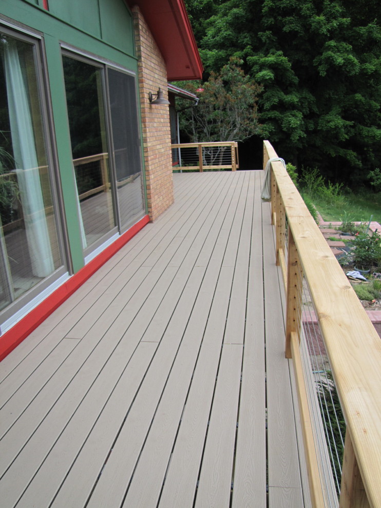 Large traditional backyard deck in Other with no cover.