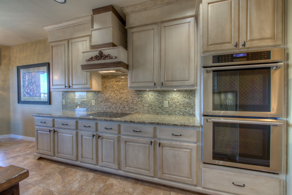 Eat-in kitchen - mid-sized rustic l-shaped eat-in kitchen idea in Austin with a single-bowl sink, wood countertops, stainless steel appliances and an island
