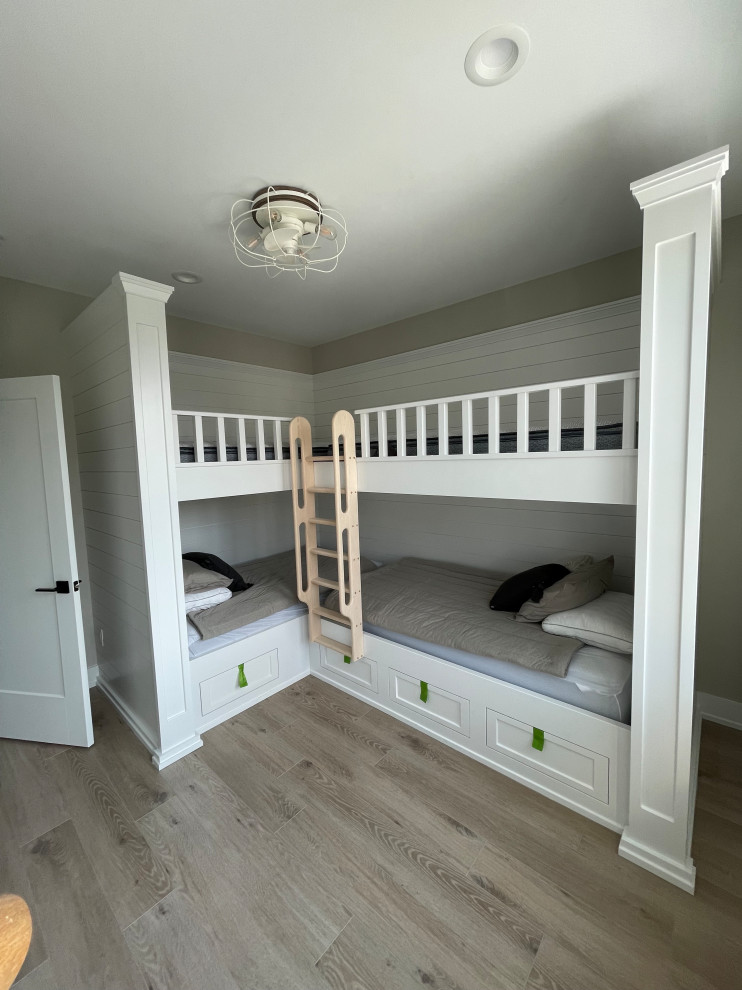 Bedroom - large transitional vinyl floor, gray floor and shiplap wall bedroom idea in New York