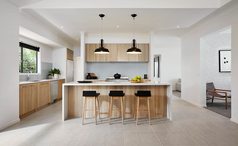 Photo of a mid-sized contemporary u-shaped kitchen in Melbourne with with island, flat-panel cabinets, light wood cabinets and grey splashback.