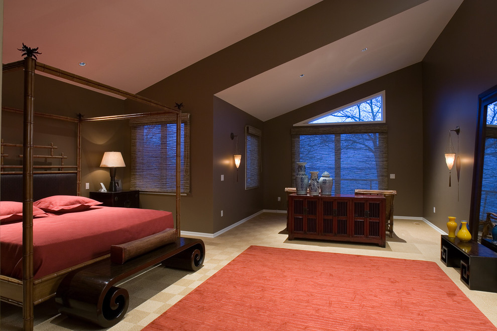 Inspiration for an asian master bedroom in Chicago with brown walls and carpet.