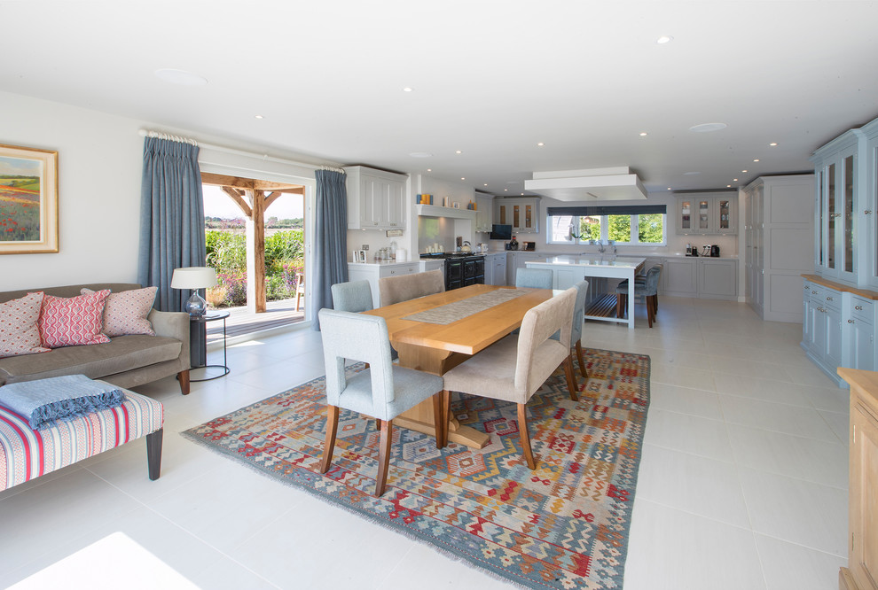 Large contemporary open plan dining in West Midlands with grey walls, porcelain floors and grey floor.
