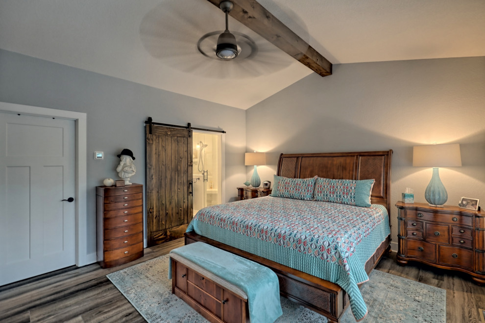 Bedroom - large craftsman master vinyl floor, gray floor and exposed beam bedroom idea in Atlanta with gray walls