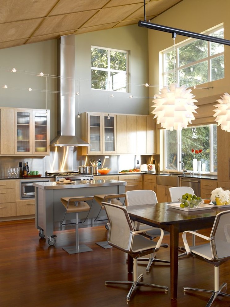 Contemporary kitchen in Seattle with flat-panel cabinets.
