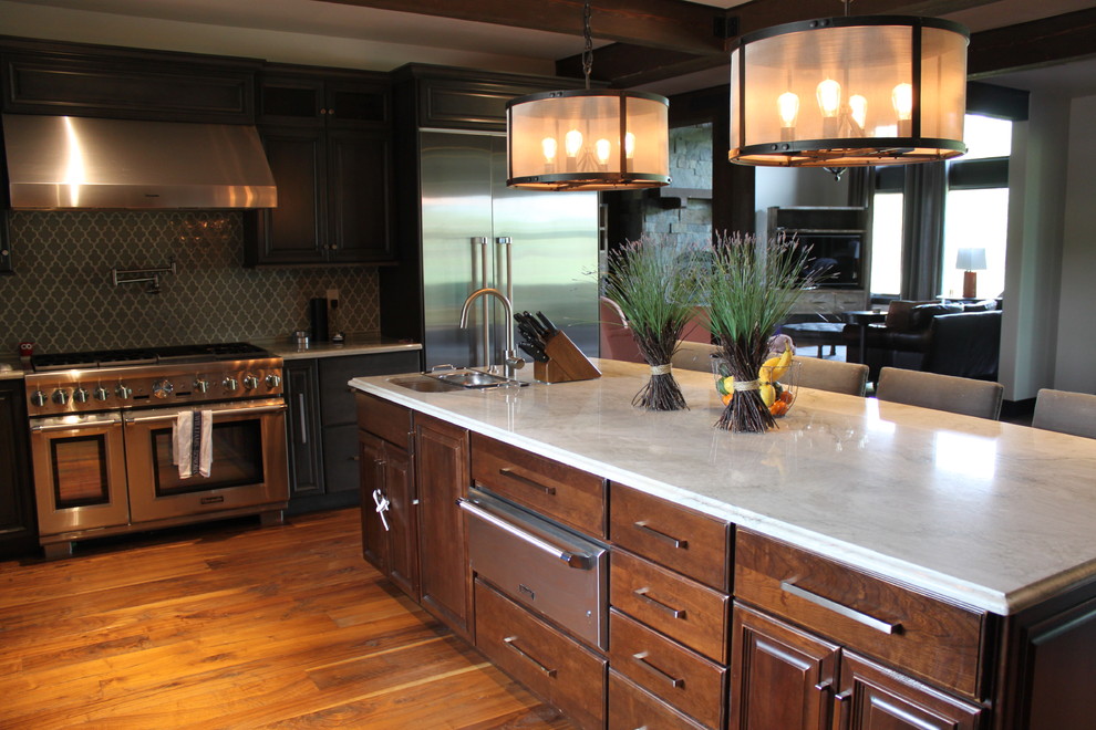 Eat-in kitchen - huge u-shaped medium tone wood floor eat-in kitchen idea with glass-front cabinets, medium tone wood cabinets, granite countertops, stainless steel appliances and an island