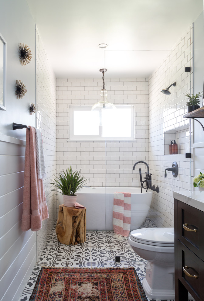 Bathroom - mid-sized cottage 3/4 white tile and subway tile cement tile floor and black floor bathroom idea in Los Angeles with shaker cabinets, brown cabinets, a two-piece toilet, gray walls, an undermount sink and marble countertops