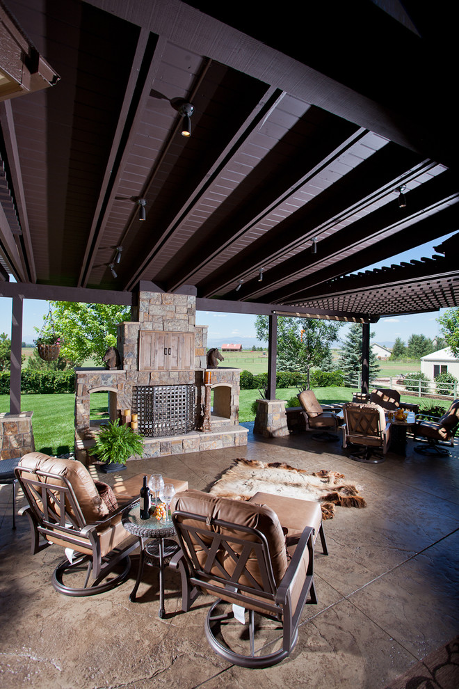Inspiration for a traditional patio in Denver with a fire feature and a pergola.