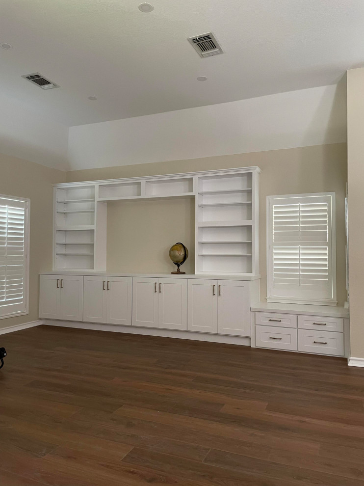 Kitchen - l-shaped kitchen idea with a single-bowl sink, white cabinets, quartz countertops, white backsplash, subway tile backsplash, stainless steel appliances, an island and white countertops