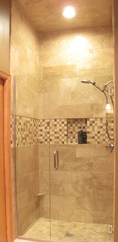 Design ideas for a mid-sized traditional 3/4 bathroom in Minneapolis with raised-panel cabinets, medium wood cabinets, a drop-in tub, an alcove shower, multi-coloured tile, mosaic tile, beige walls, porcelain floors, an undermount sink and engineered quartz benchtops.