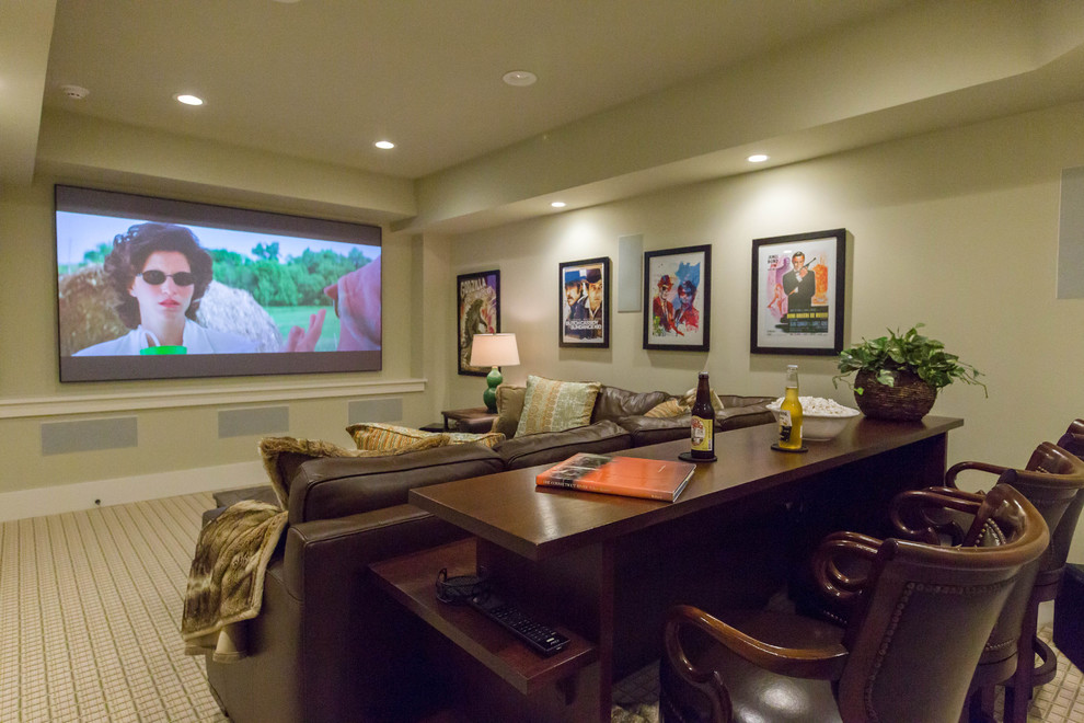 Photo of a mid-sized transitional enclosed home theatre in New York with green walls, carpet and a projector screen.