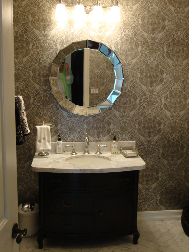 This is an example of a traditional powder room in Orange County.