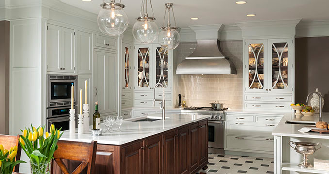 Large transitional u-shaped porcelain tile and multicolored floor eat-in kitchen photo in Chicago with a drop-in sink, beaded inset cabinets, white cabinets, quartzite countertops, beige backsplash, mosaic tile backsplash, stainless steel appliances, an island and white countertops