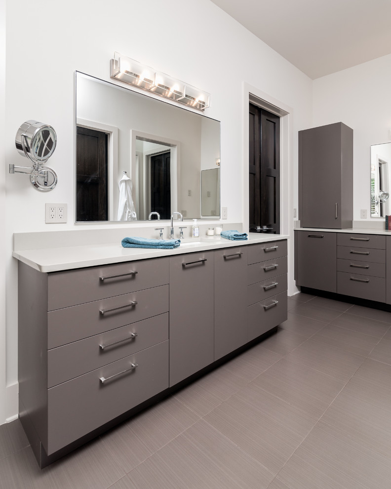 Mid-sized contemporary master bathroom in Atlanta with flat-panel cabinets, grey cabinets, quartzite benchtops, white tile, an undermount sink, a freestanding tub, a corner shower, a one-piece toilet, ceramic tile, white walls and porcelain floors.