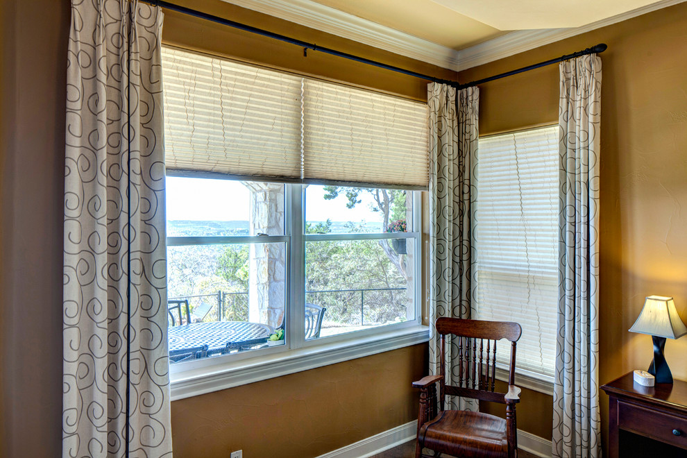 Large transitional master medium tone wood floor home design photo in Austin with beige walls