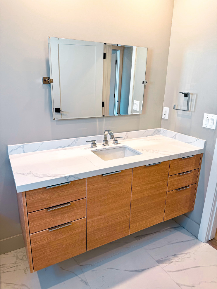 Design ideas for a mid-sized modern 3/4 bathroom in Los Angeles with flat-panel cabinets, brown cabinets, a shower/bathtub combo, engineered quartz benchtops, a sliding shower screen, white benchtops, a single vanity, a floating vanity, an alcove tub, an undermount sink, beige walls, porcelain floors and white floor.