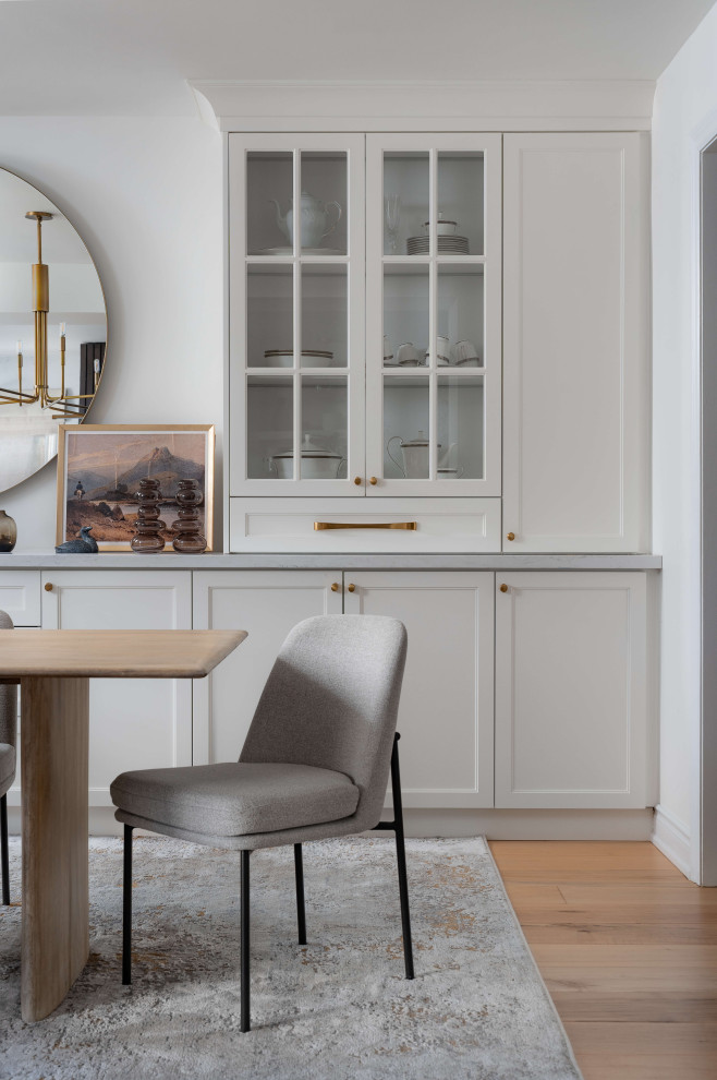 Kitchen/dining room combo - mid-sized transitional medium tone wood floor and beige floor kitchen/dining room combo idea in Toronto with white walls