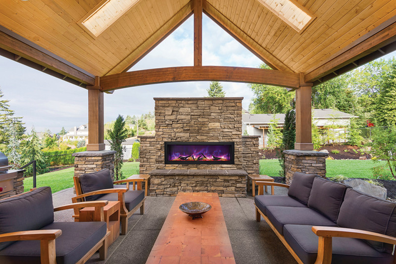 Photo of a large transitional backyard patio in Salt Lake City with a fire feature, stamped concrete and a gazebo/cabana.