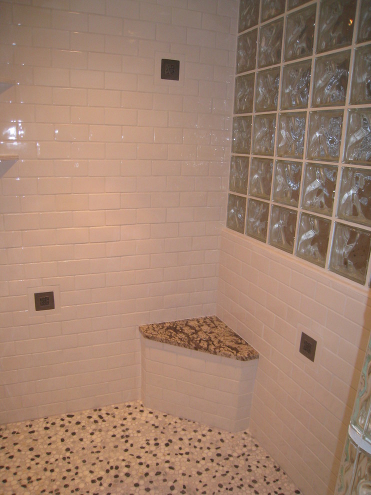 Example of a mid-sized transitional master white tile and subway tile pebble tile floor home design design in Seattle with granite countertops