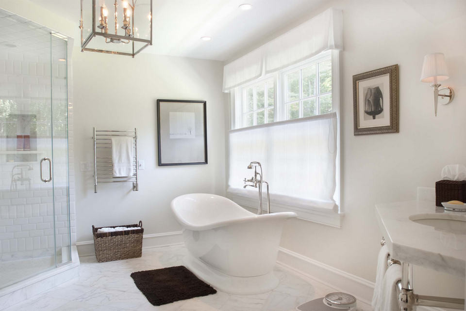 Mid-sized transitional master white tile and subway tile marble floor and white floor freestanding bathtub photo in Toronto with white walls, an undermount sink, marble countertops and a hinged shower door