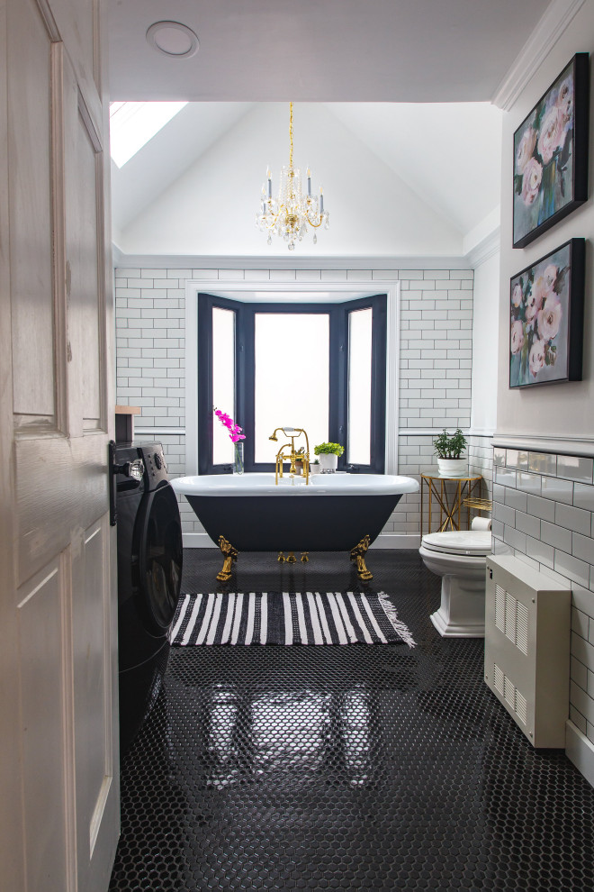 Photo of a mid-sized transitional bathroom in Boston with a claw-foot tub, a two-piece toilet, white tile, subway tile, white walls, a pedestal sink, a single vanity and a freestanding vanity.
