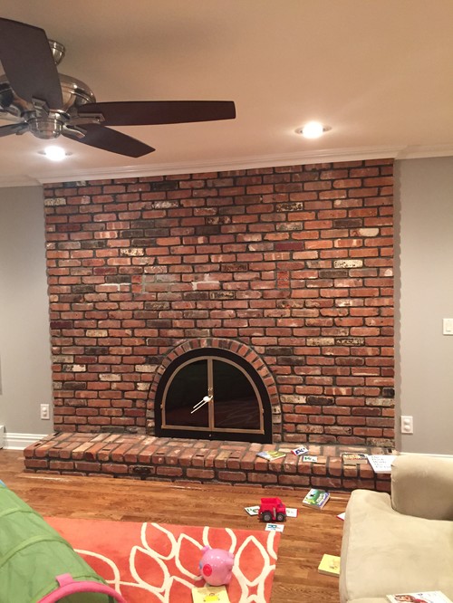 Need help for a fireplace facelift We bought a fixer upper built in 1972. We repainted and thought we would do a stone veneer on the fireplace but have no money in our budget. The brick has grown on me but I can
