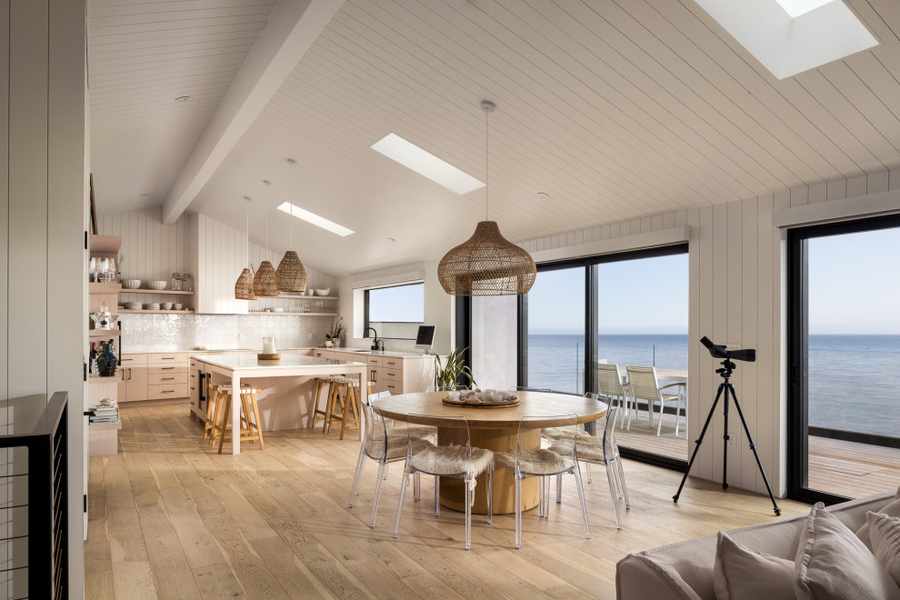 Trendy light wood floor, beige floor, shiplap ceiling, vaulted ceiling and shiplap wall great room photo in San Luis Obispo with white walls