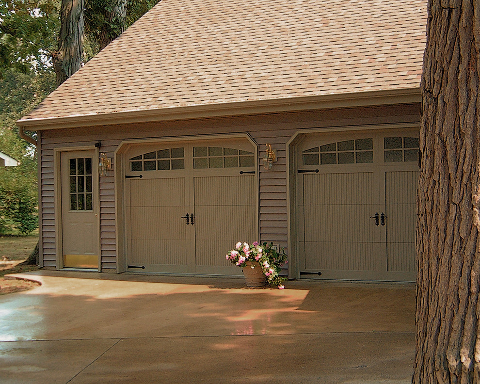 Inspiration for a mid-sized traditional attached two-car garage in Minneapolis.