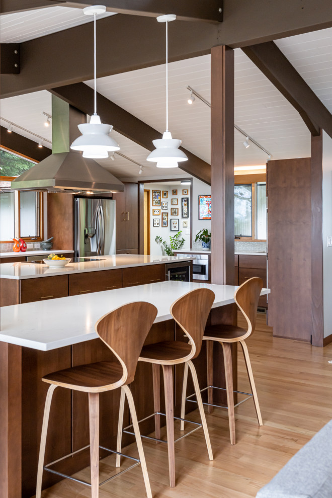 Inspiration for a mid-sized midcentury kitchen in Other with a single-bowl sink, flat-panel cabinets, medium wood cabinets, quartzite benchtops, green splashback, porcelain splashback, stainless steel appliances, light hardwood floors, with island, beige floor, white benchtop and exposed beam.