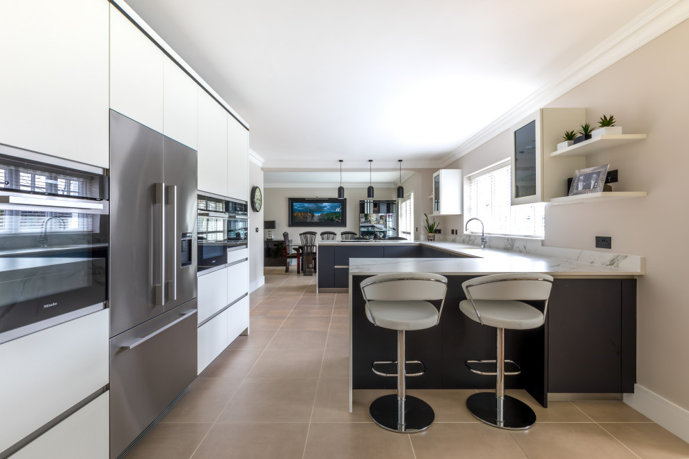 Example of a trendy kitchen design in Sussex