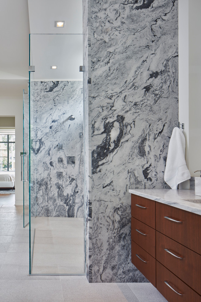 Inspiration for a large contemporary bathroom in Atlanta with open cabinets, medium wood cabinets, a japanese tub, a curbless shower, a wall-mount toilet, white tile, marble, white walls, limestone floors, an undermount sink, marble benchtops, white floor, a hinged shower door and white benchtops.