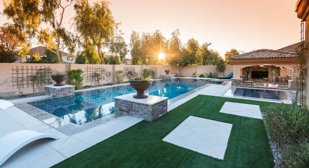 Example of a large backyard rectangular natural hot tub design in Phoenix