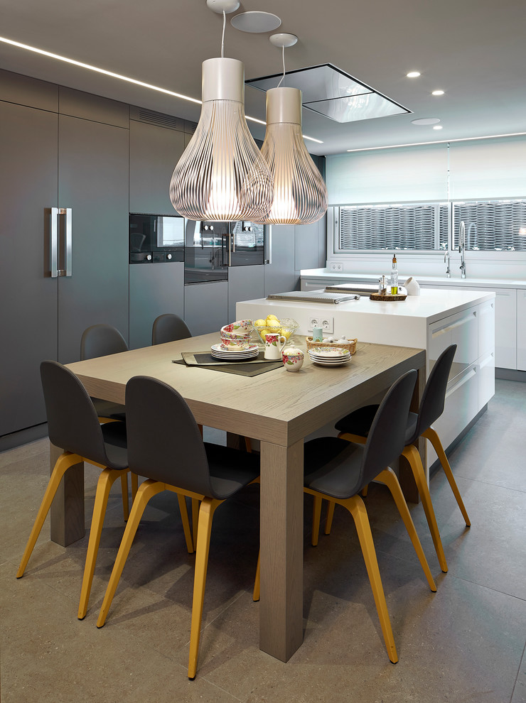 This is an example of a contemporary kitchen in Barcelona with ceramic floors, flat-panel cabinets, brown cabinets and black appliances.