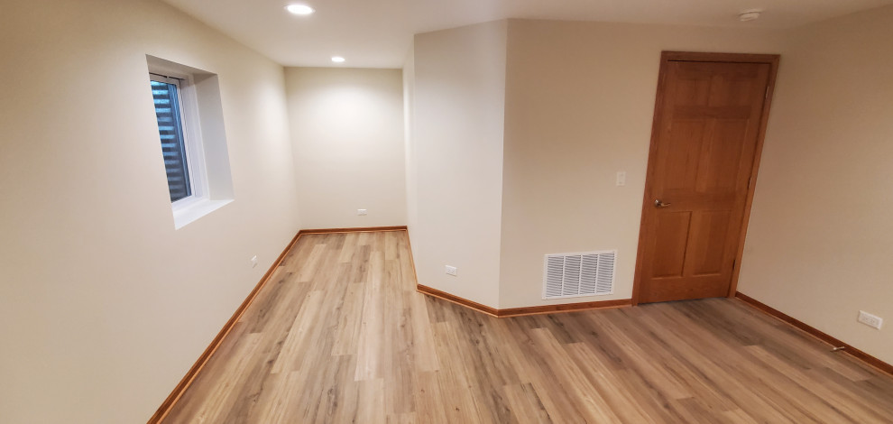 Finished basement with clipped corner around furnace/utility area