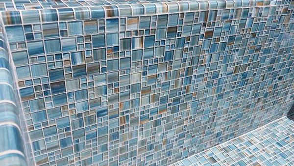 Photo of a backyard pool in Miami with tile.