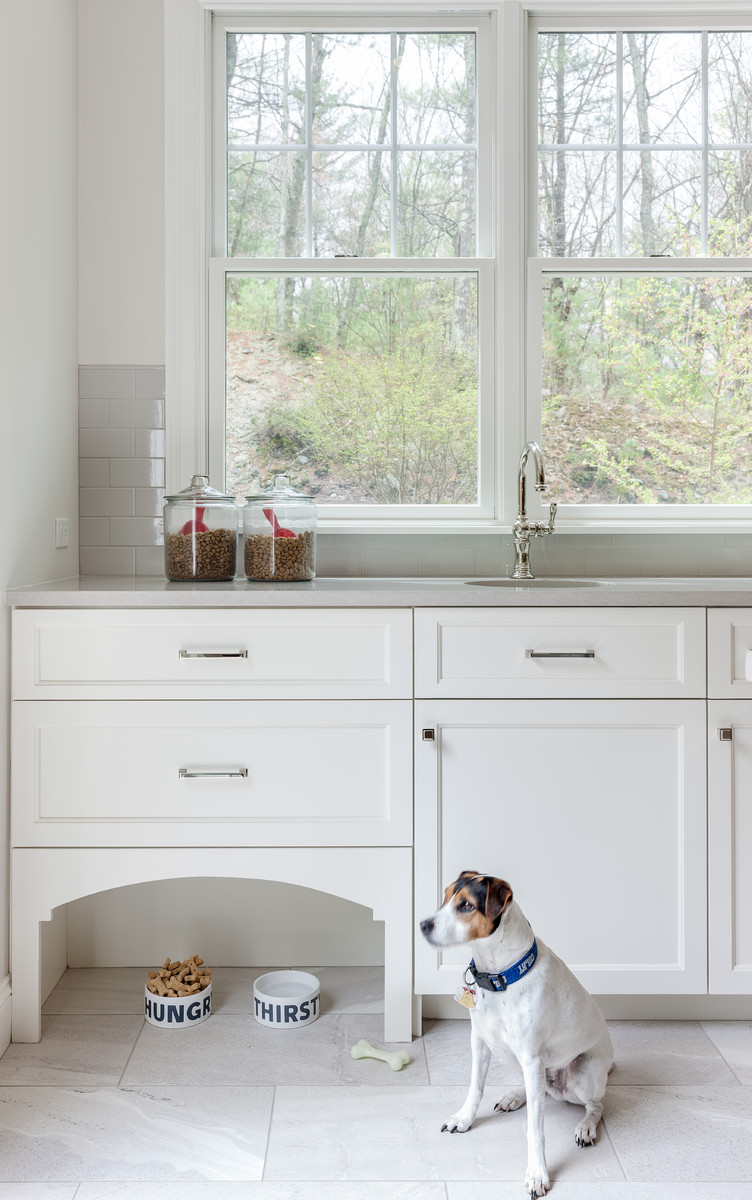 Example of a transitional kitchen design in Boston with an undermount sink, gray cabinets, quartzite countertops, subway tile backsplash, stainless steel appliances and an island
