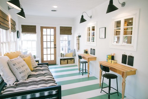 bright covered porch area with natural light