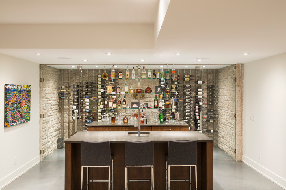 This is an example of an expansive modern home bar in Calgary.