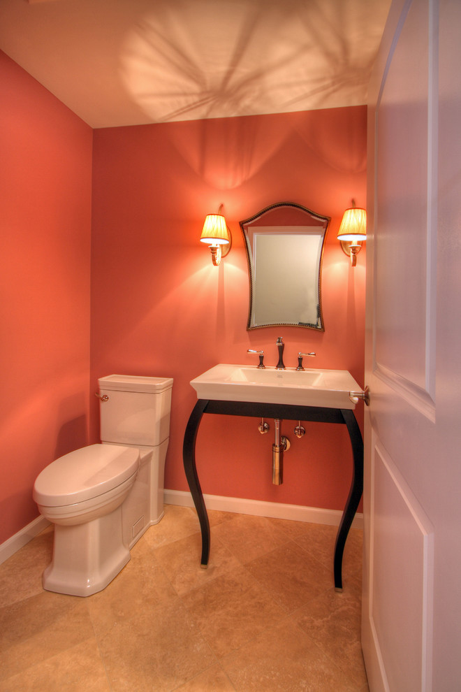 Small eclectic powder room in St Louis with a vessel sink, a two-piece toilet, pink walls, marble floors and beige floor.