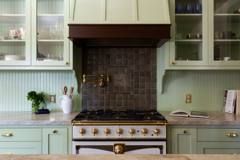 Kitchen pantry - large craftsman kitchen pantry idea in Los Angeles with a farmhouse sink, shaker cabinets, green cabinets, quartzite countertops, green backsplash, ceramic backsplash, an island and green countertops