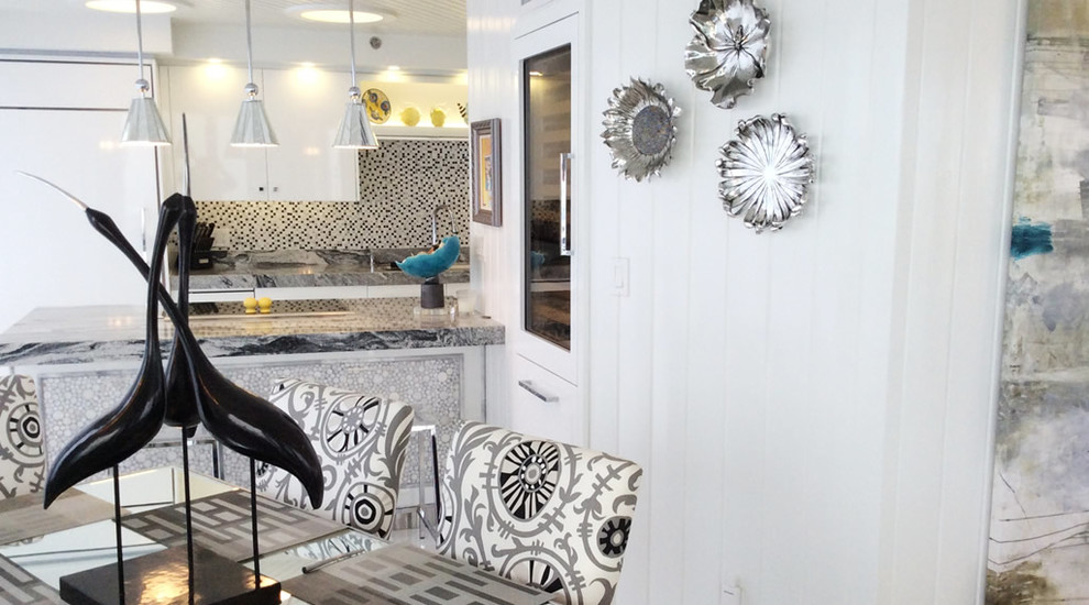 Mid-sized minimalist galley eat-in kitchen photo in Austin with an island