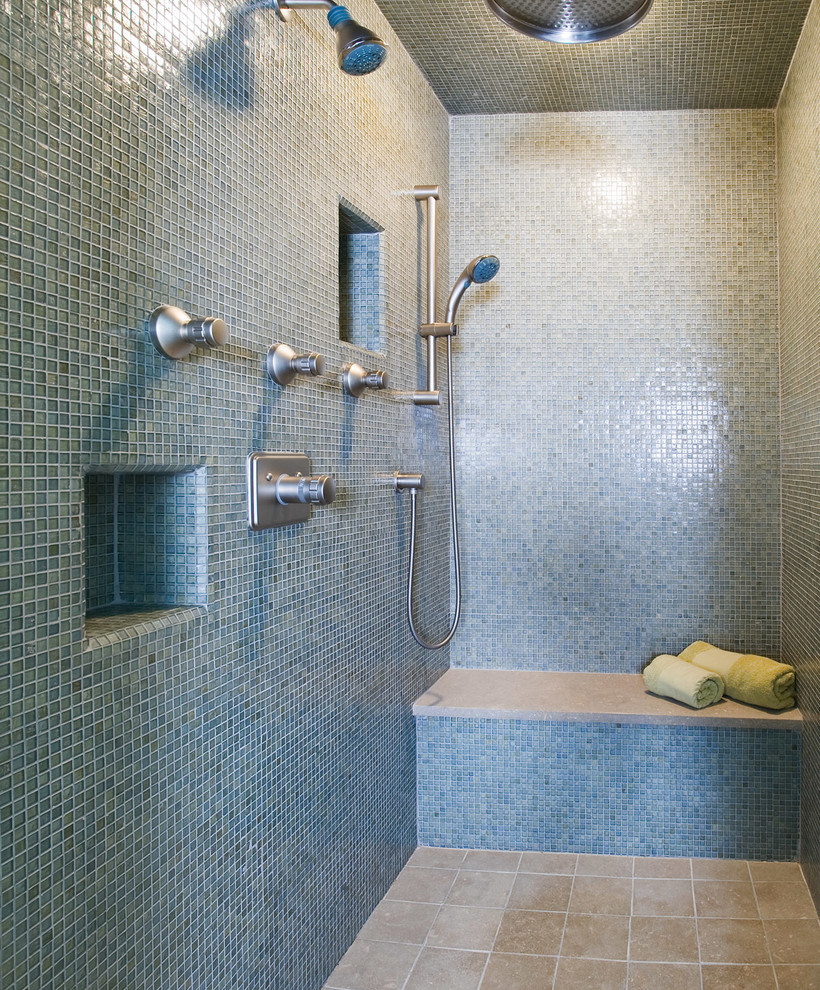 Photo of a large eclectic master bathroom in Other with an open shower, beige tile, mosaic tile, blue walls, limestone floors, furniture-like cabinets, a hinged shower door and beige floor.