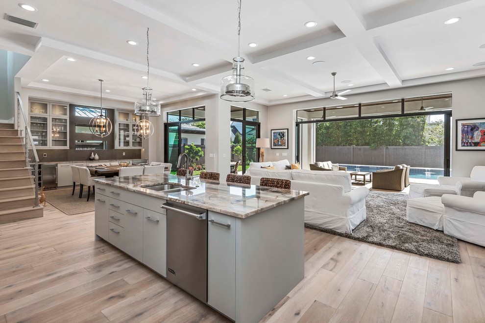 Inspiration for a large contemporary l-shaped open plan kitchen in Orlando with an undermount sink, flat-panel cabinets, white cabinets, marble benchtops, multi-coloured splashback, marble splashback, stainless steel appliances, light hardwood floors, with island and multi-coloured benchtop.