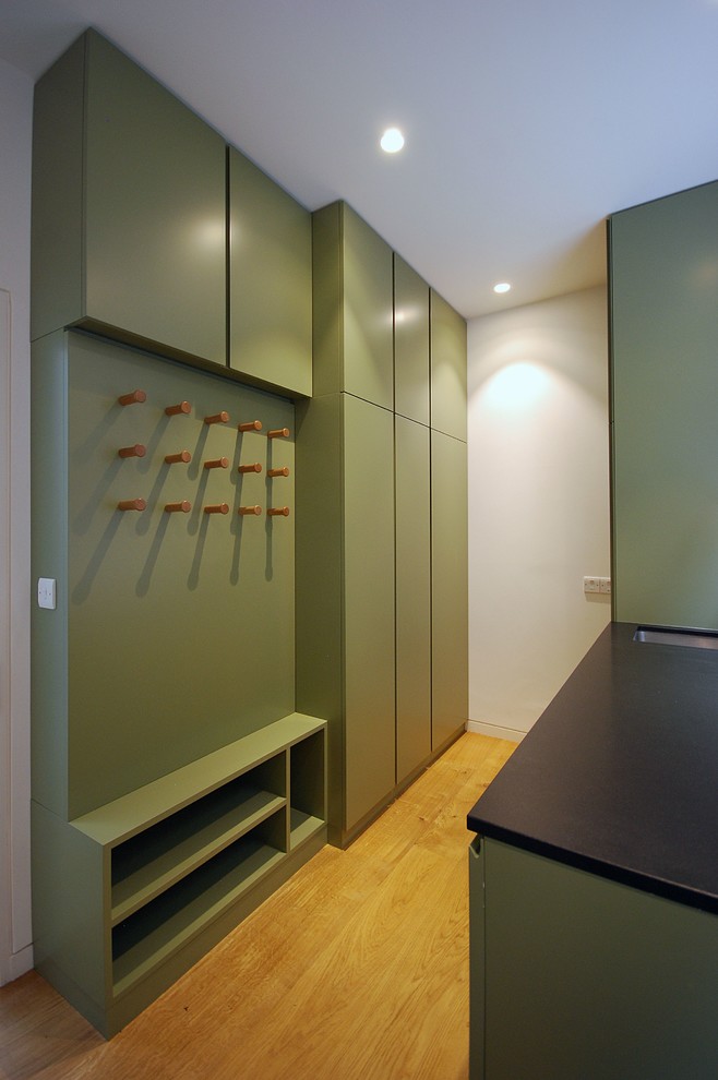 This is an example of a contemporary laundry room in London.