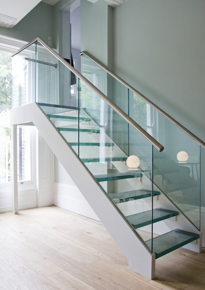 Inspiration for a mid-sized modern glass straight staircase in Other with open risers and glass railing.